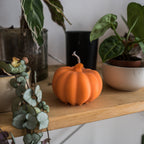 Orange pumpkin decorative candle